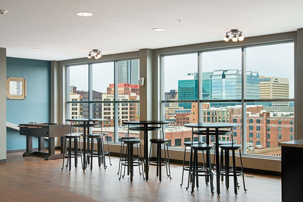 a dining room with a view of the city