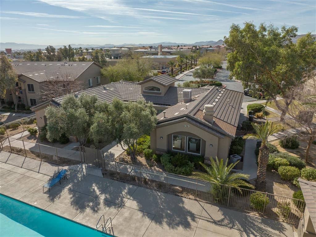 a aerial view of a house and a swimming pool