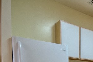 Kitchen with white and wooden cabinets and grey counter tops - Photo Gallery 3