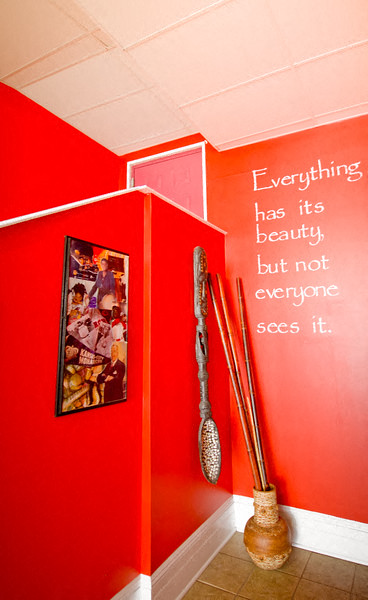 Lobby decorations with red walls and wooden vase and bamboo sticks