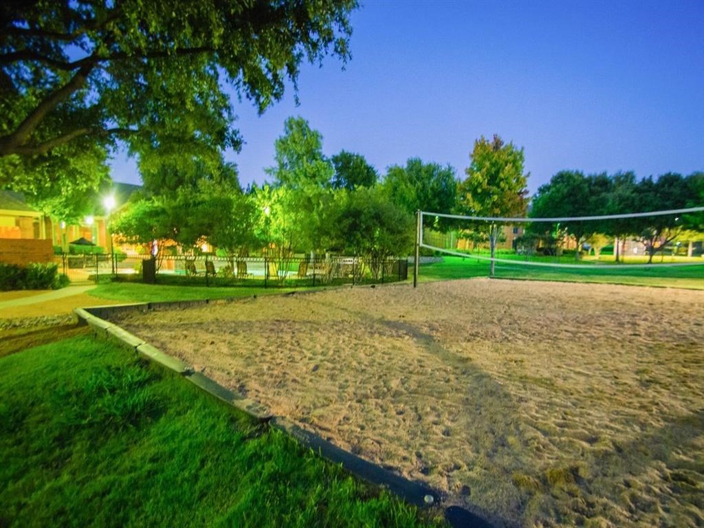 a volleyball court in a park at night