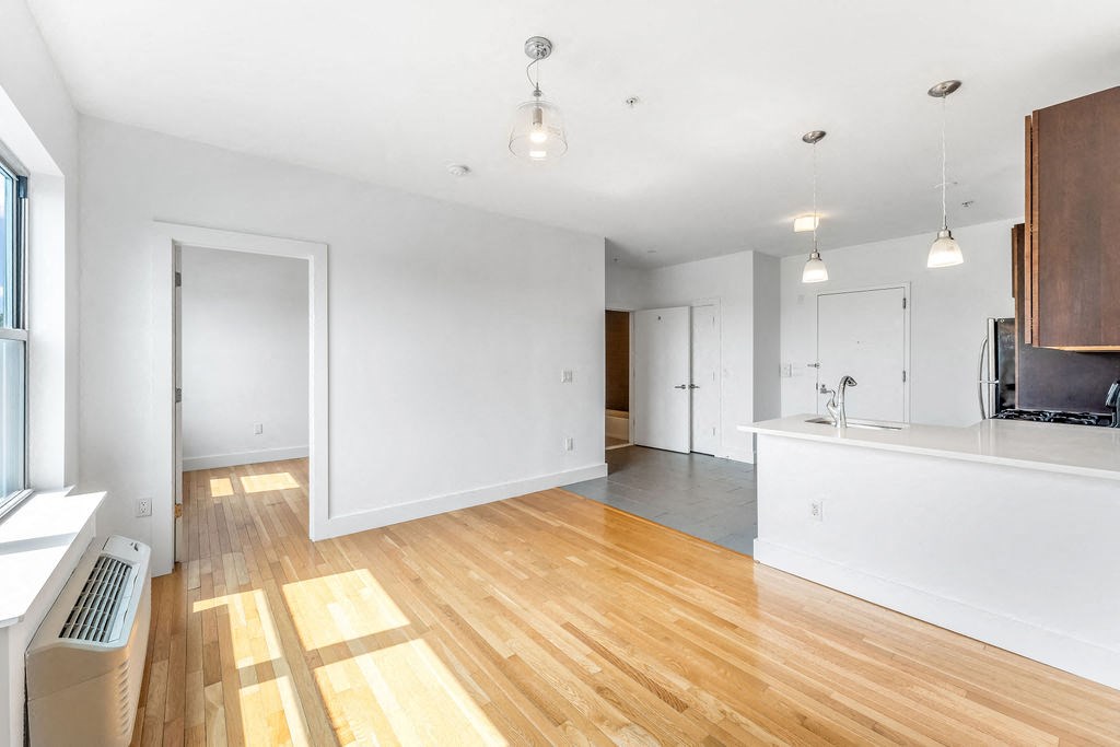 a kitchen with stainless steel appliances and wooden cabinets