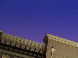 a view of an apartment building at night