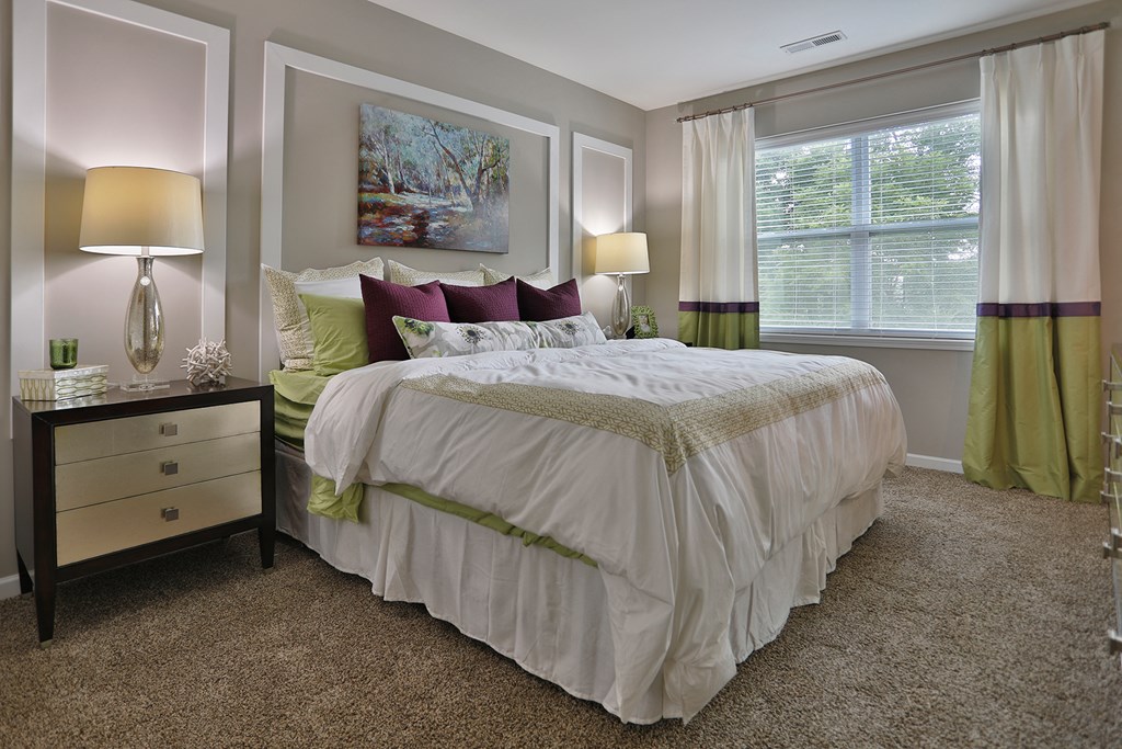 a bedroom with a bed and a dresser