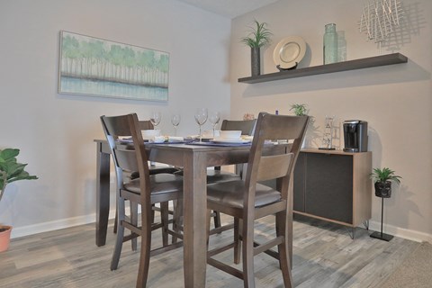 a dining room with a table and chairs and aertainment center