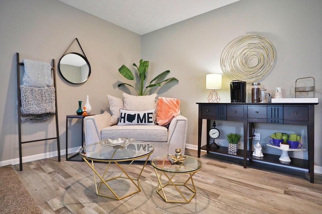 a living room with a chair and a table