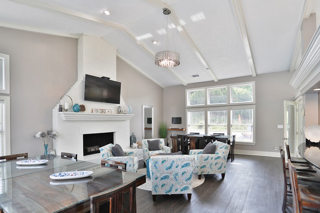 a living room with a fireplace and a tv above it