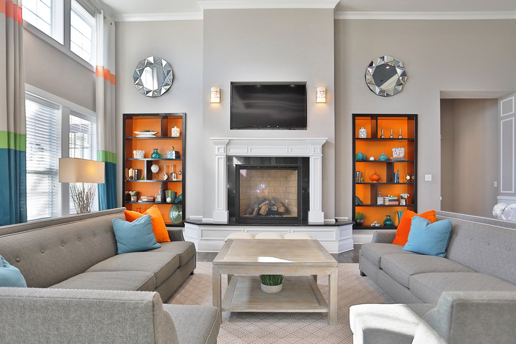 a living room with couches and a fireplace