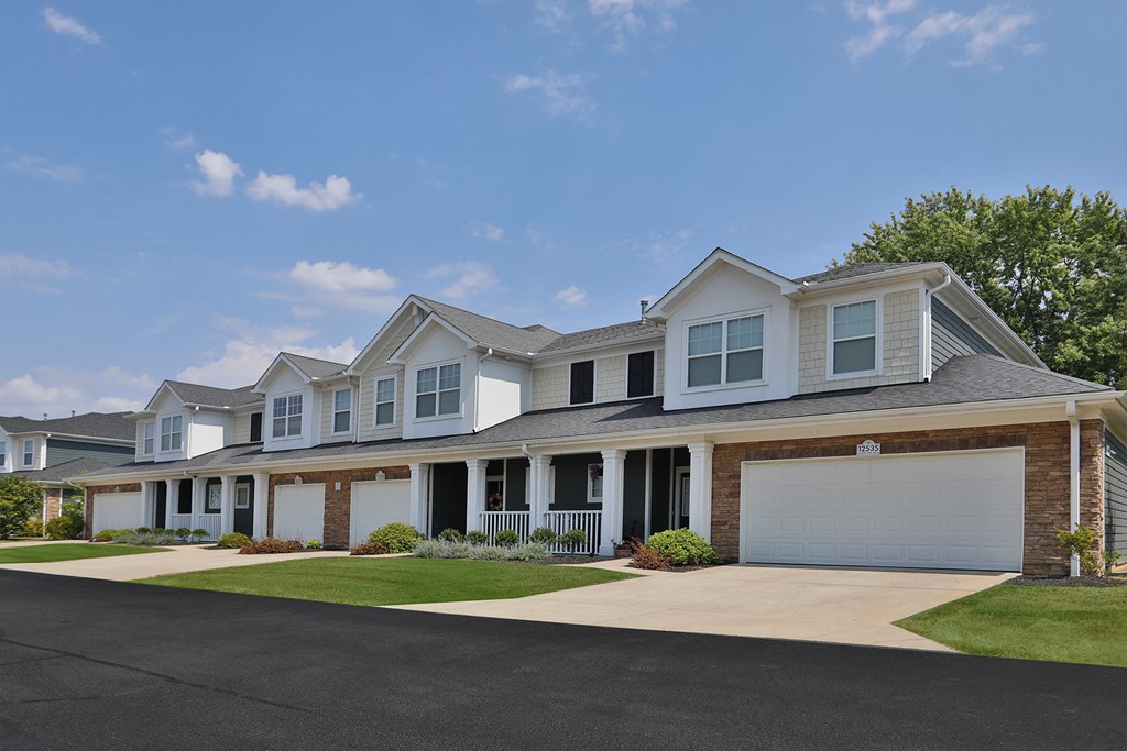 a house with a driveway and a lawn