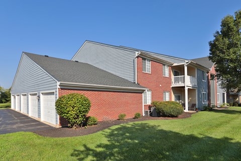 A house with a red brick exterior and a grey roof.