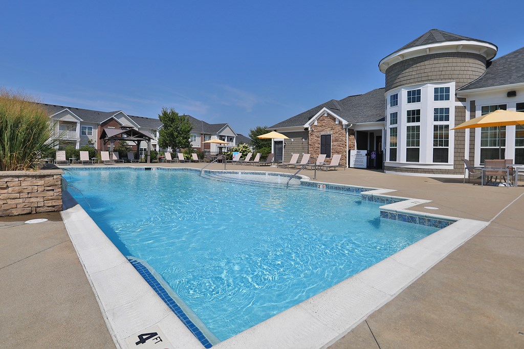 a swimming pool with a building in the background