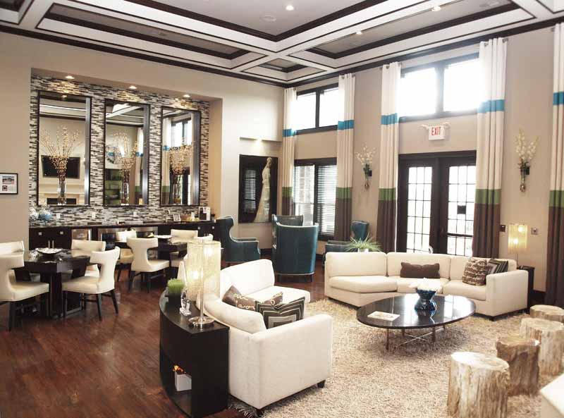 a lobby with couches tables and chairs and a bar