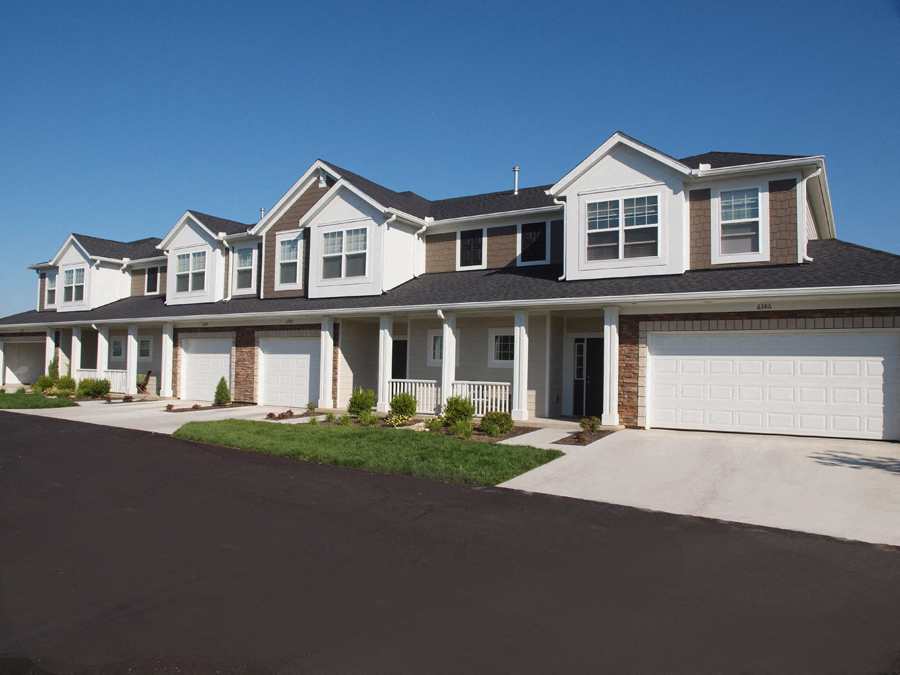 a large house with a garage and a driveway