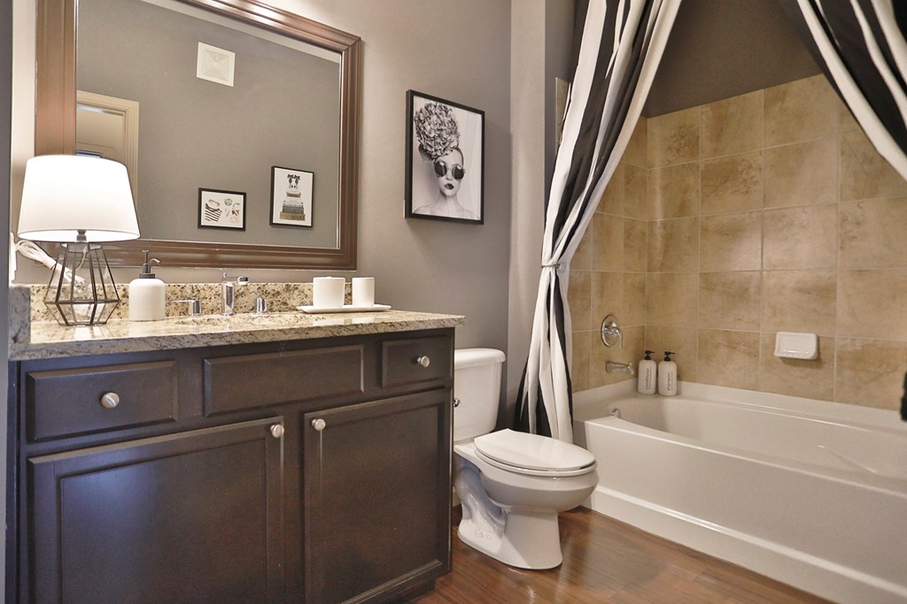 a bathroom with a sink toilet and a bath tub