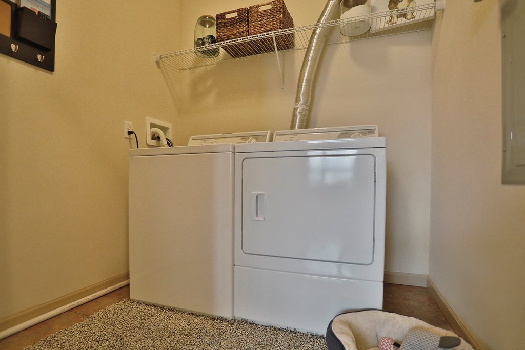 a washer and dryer in the corner of a room