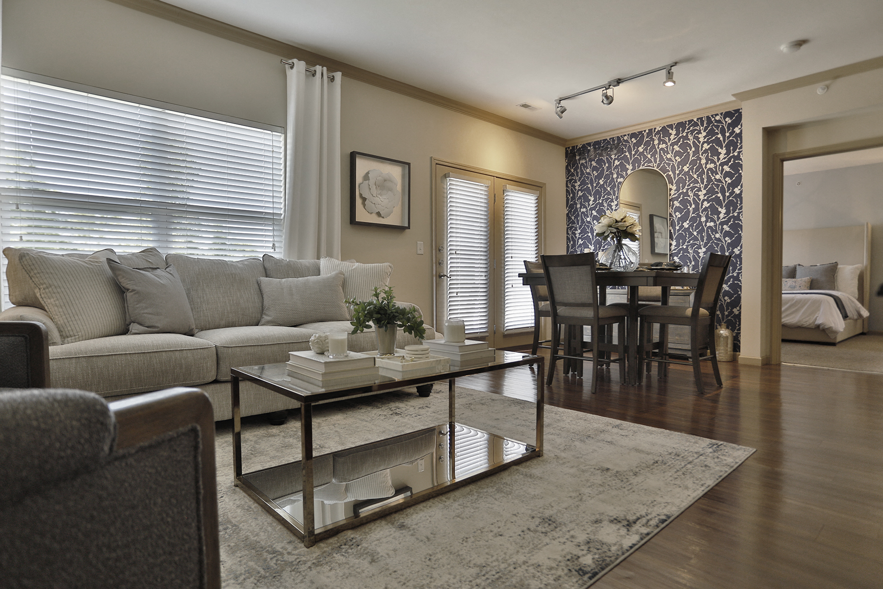 a living room and dining room with a couch and a table