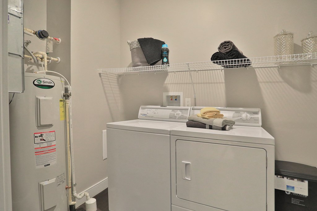 a laundry room with a washing machine and a dryer