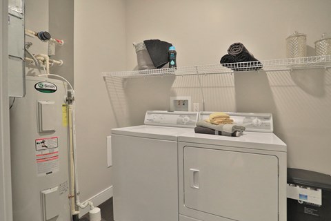 a laundry room with a washing machine and a dryer