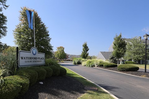 a view of the waterford place sign on the side of a road