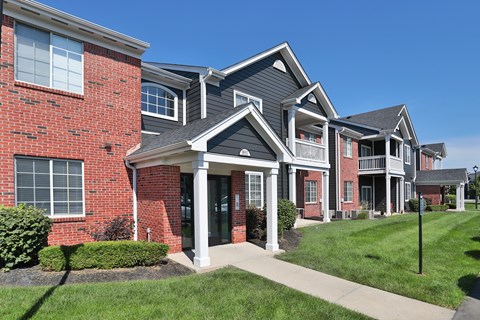 A row of houses with a red brick facade.