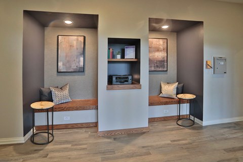 A room with a bench and a table in it.