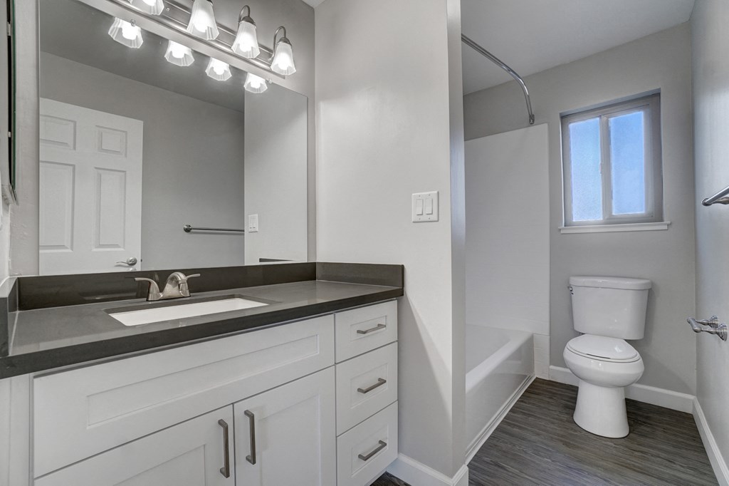 an empty bathroom with a sink and a toilet