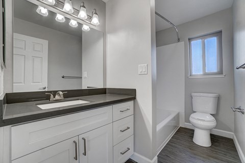 an empty bathroom with a sink and a toilet