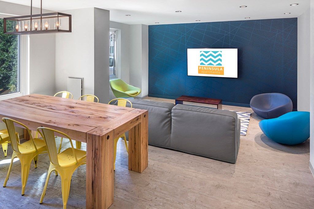 a living room with a table and chairs and a couch