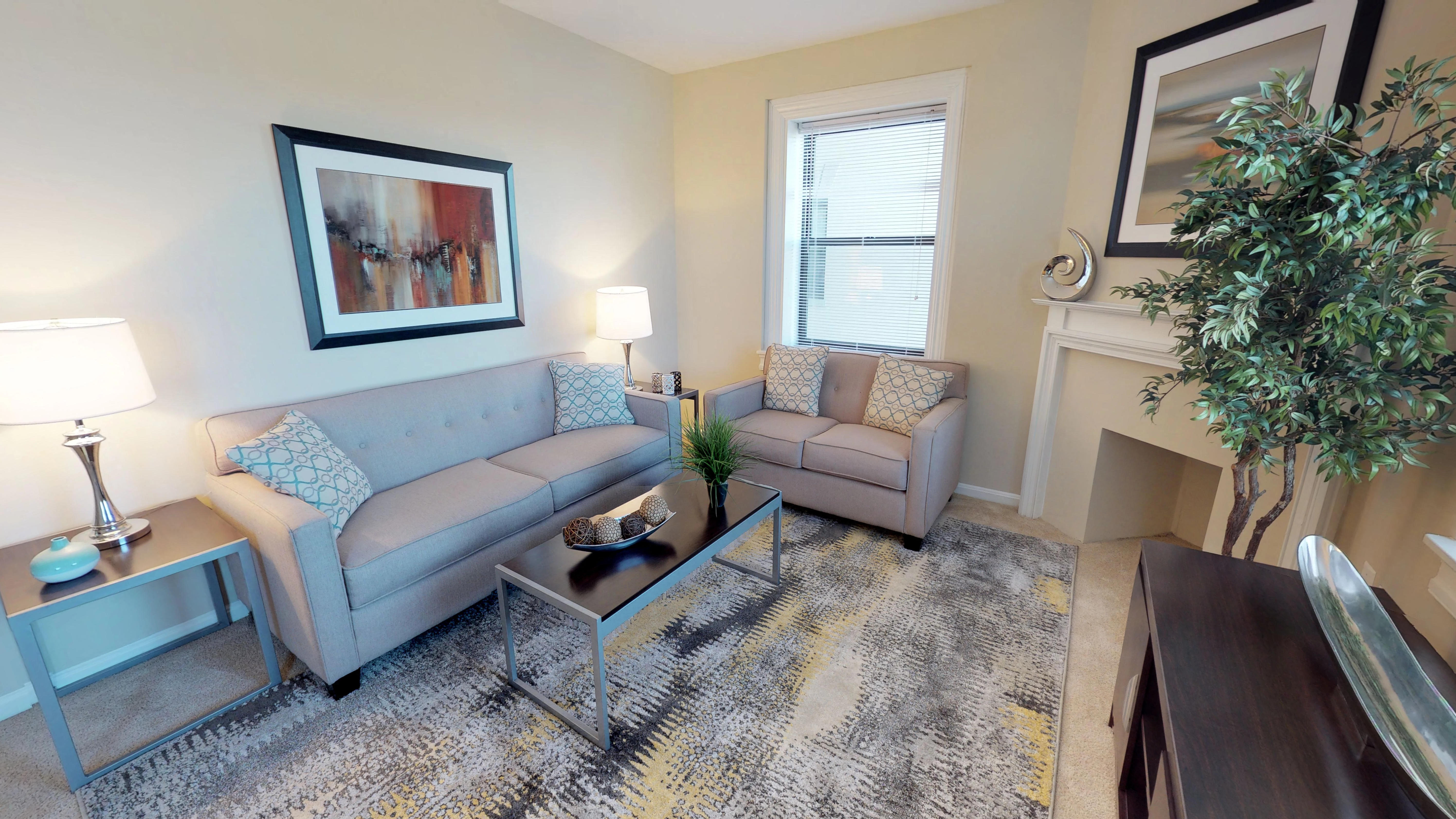 a living room with a couch and a coffee table