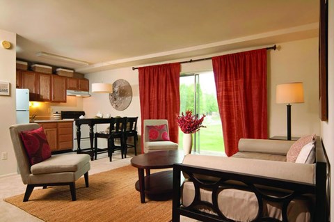 A living room with a sofa, chair, and table.