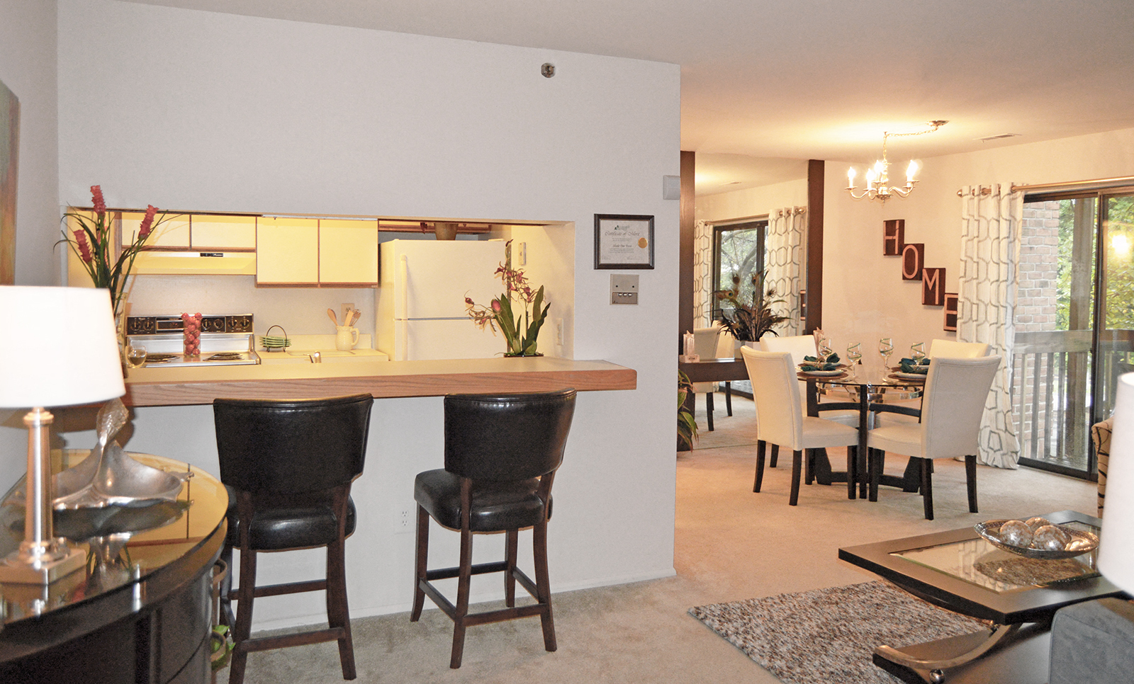 A dining room with a table set for two.