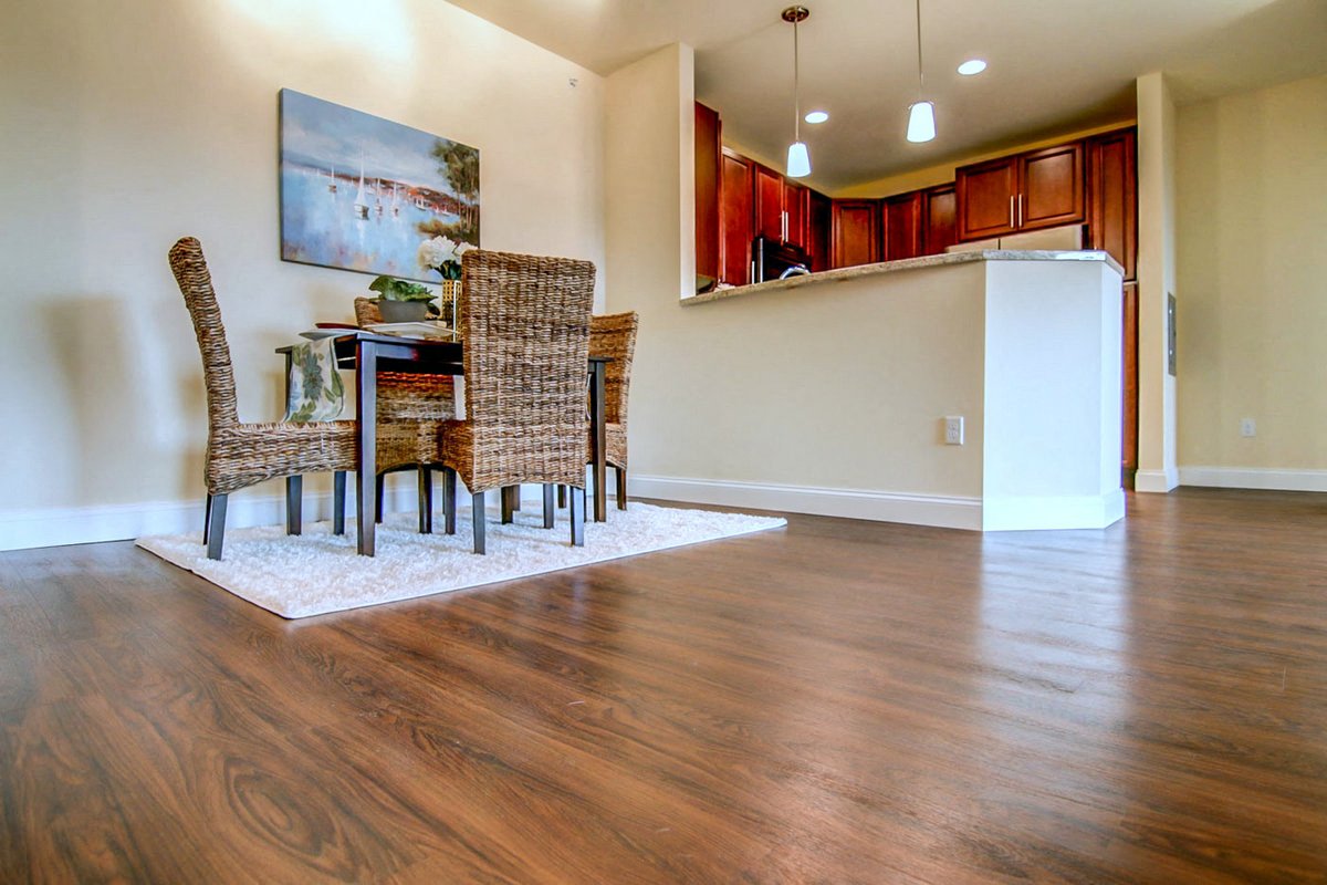 a dining room with a table and chairs in a living room