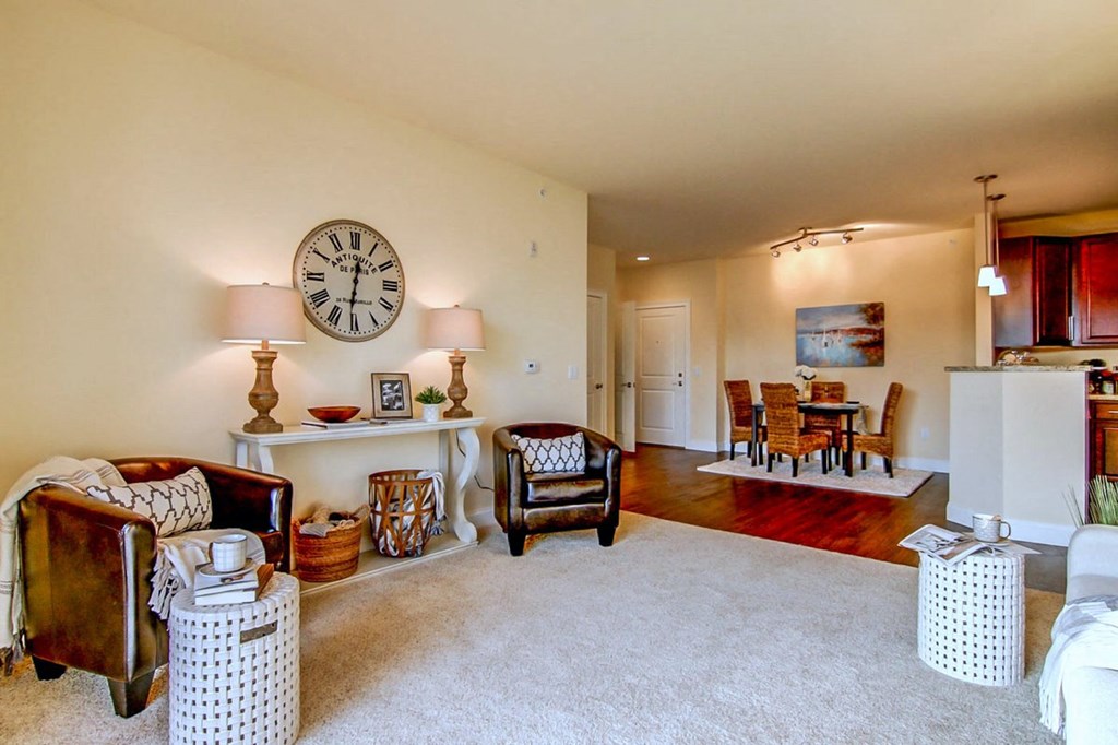 a living room with a large clock on the wall