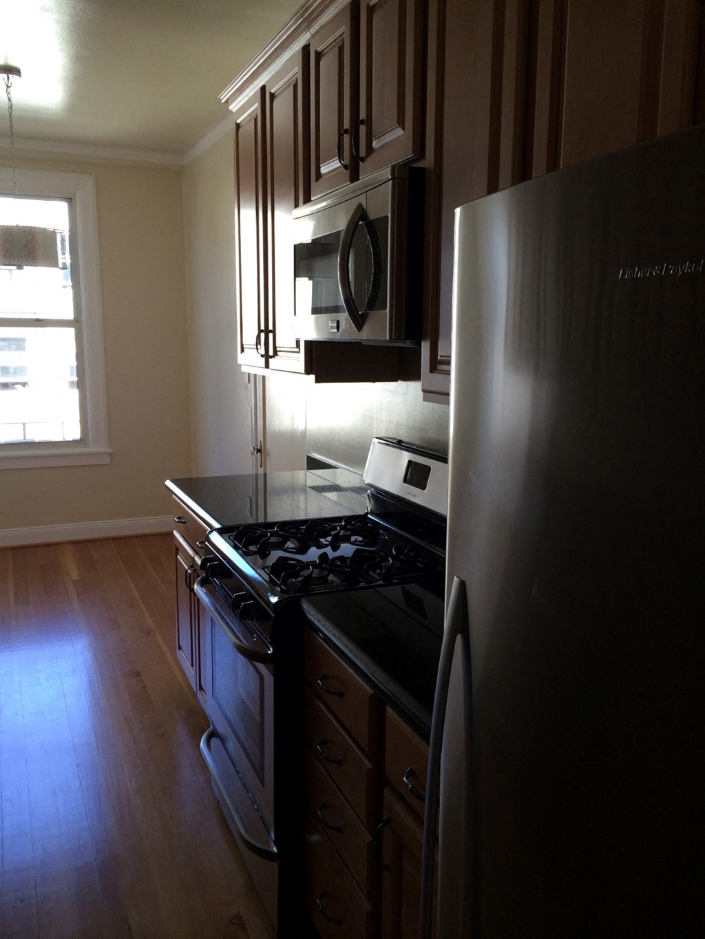 a kitchen with a stove and a refrigerator