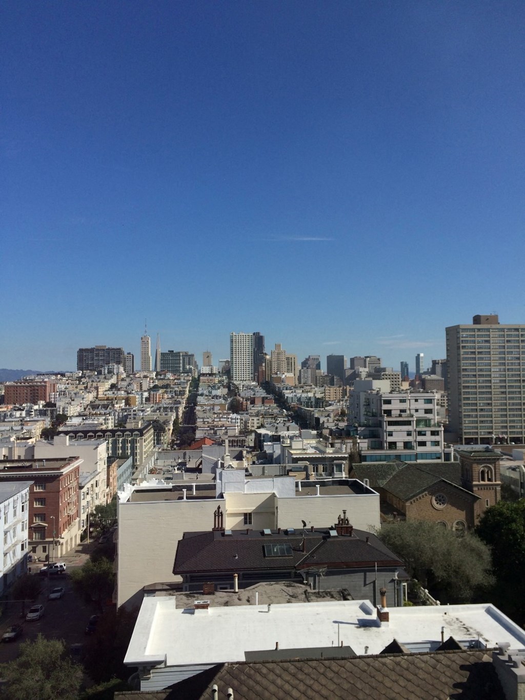 a view of the city from the roof of a building