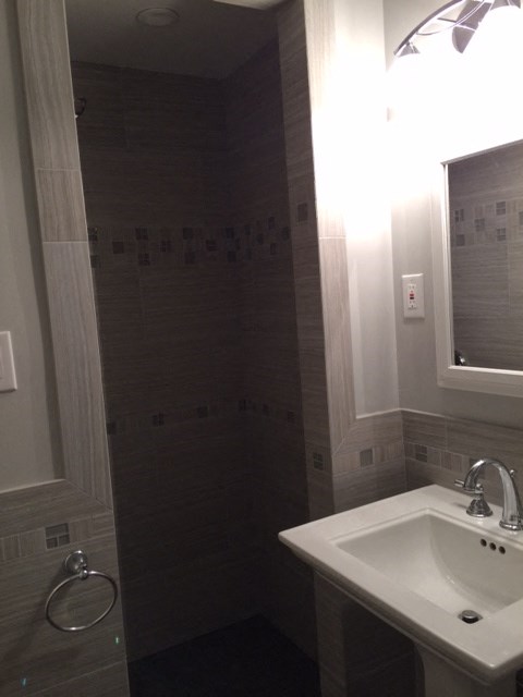 a small bathroom with a sink and a mirror