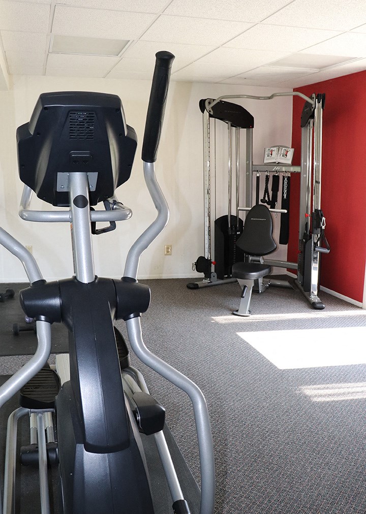 a gym with a lot of equipment in it