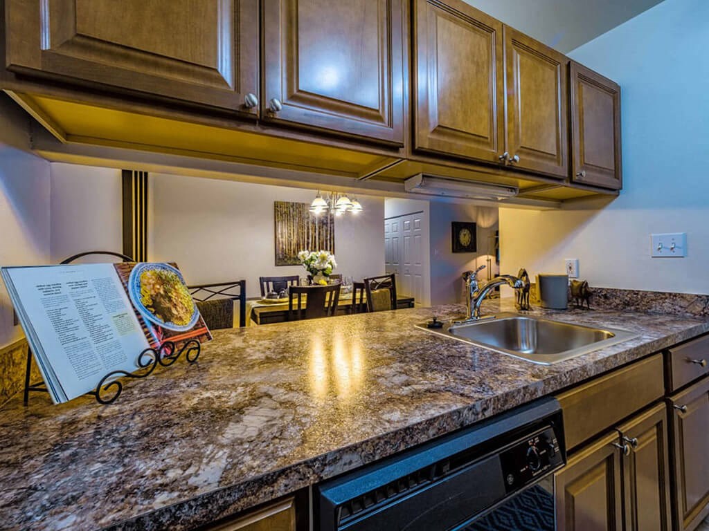 a kitchen with a counter top and a sink