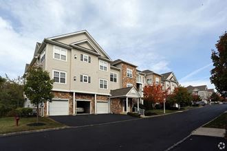 a row of town houses on the side of a street
