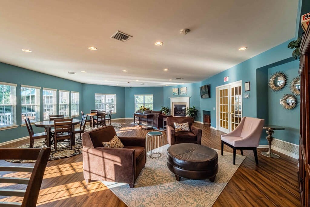 a living room with furniture and a fireplace