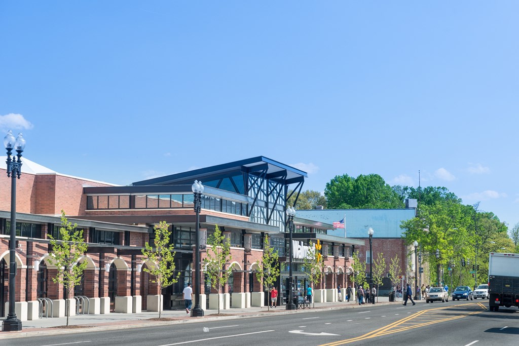 a rendering of a building on a city street
