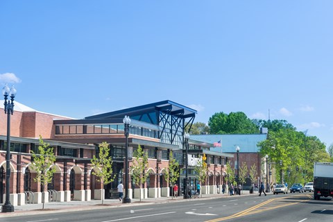 a rendering of a building on a city street