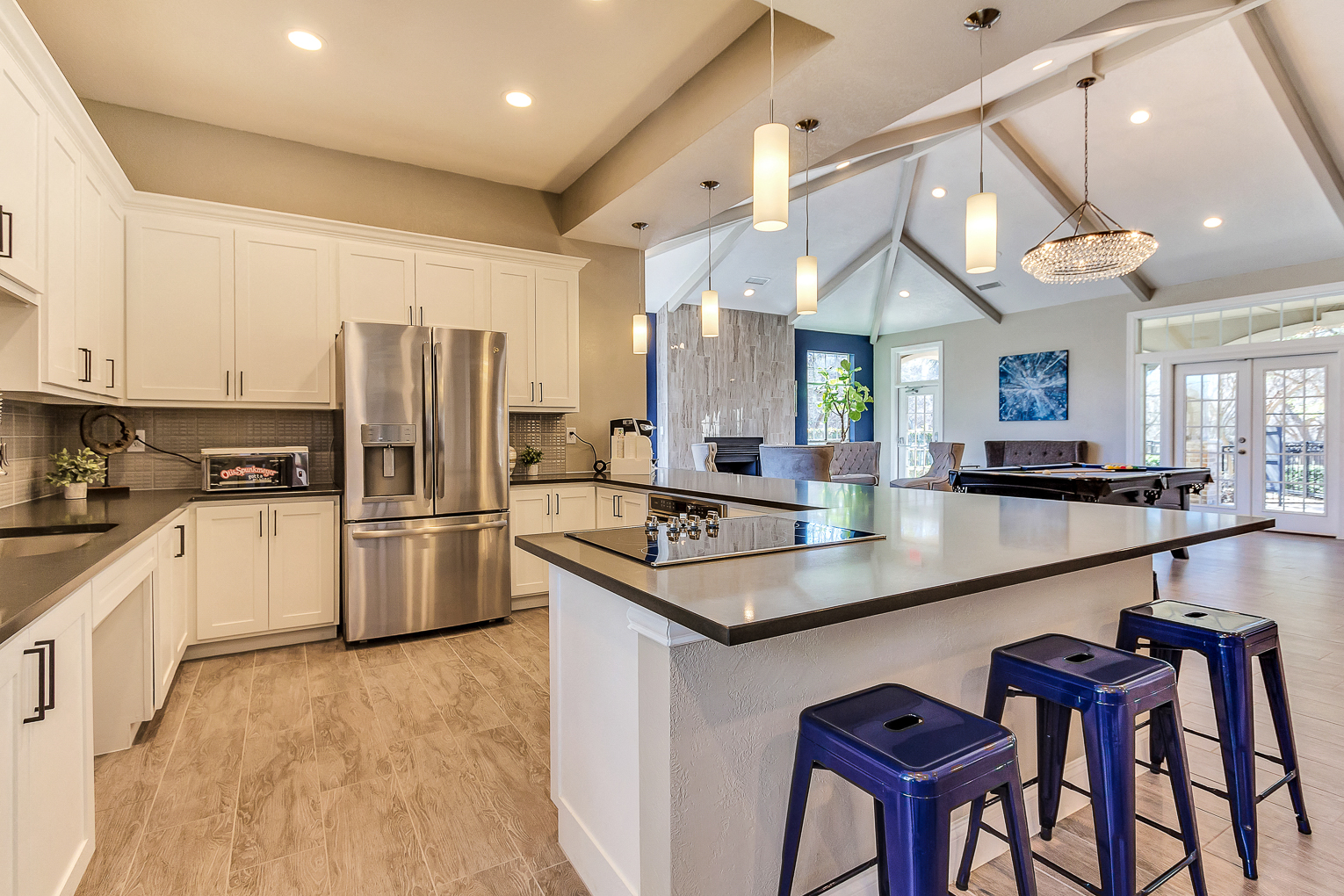 Modern resident lounge with entertainment kitchen, games and lounge seating