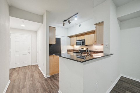 the preserve at ballantyne commons apartments redesigned kitchen with black counter tops and wood