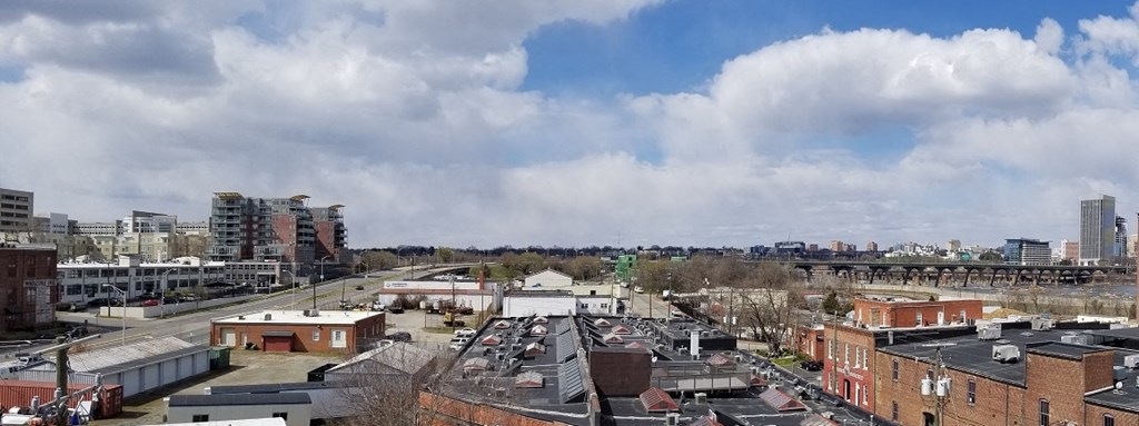 the view of the city from the roof of a building