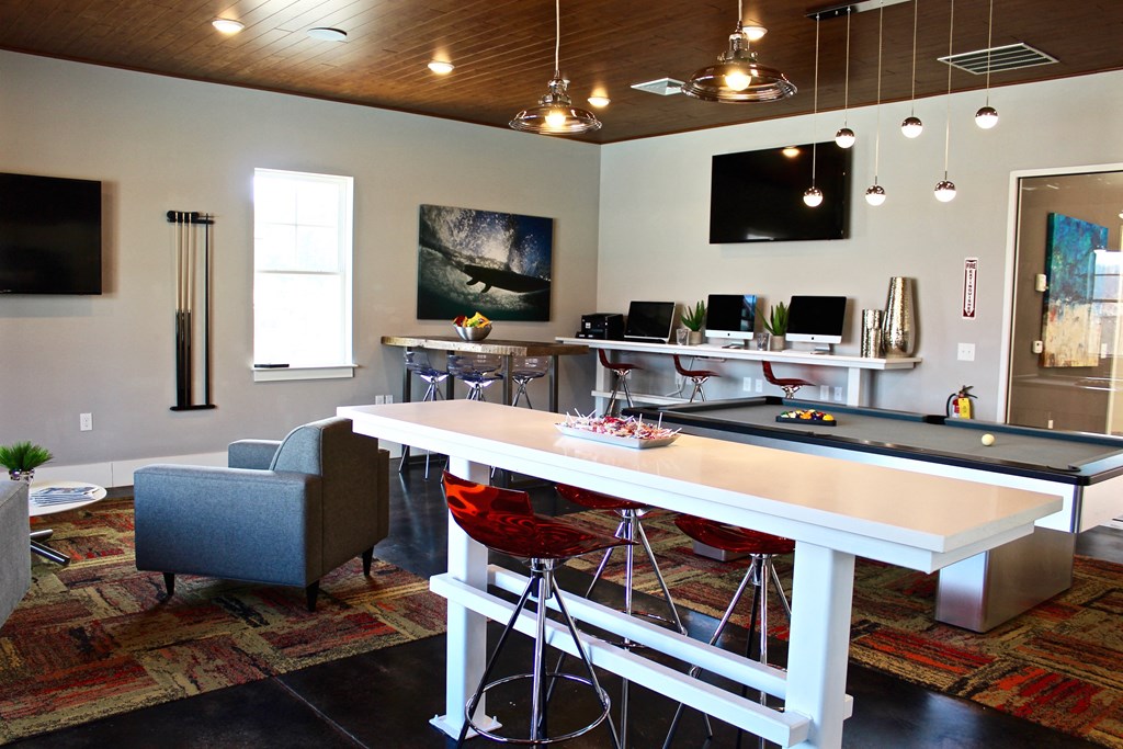 a games room with a ping pong table and a pool table