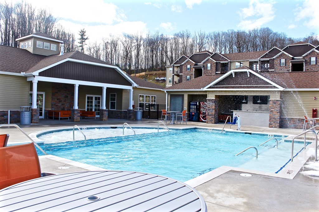 a swimming pool in front of a house