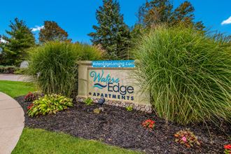 the welcome sign at wins edge apartments