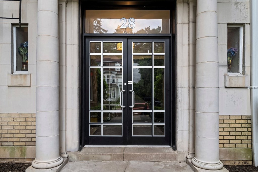 the entrance to a building with glass doors