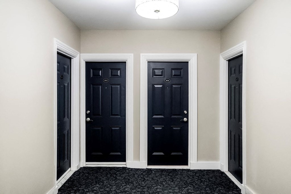 a row of four doors in a room
